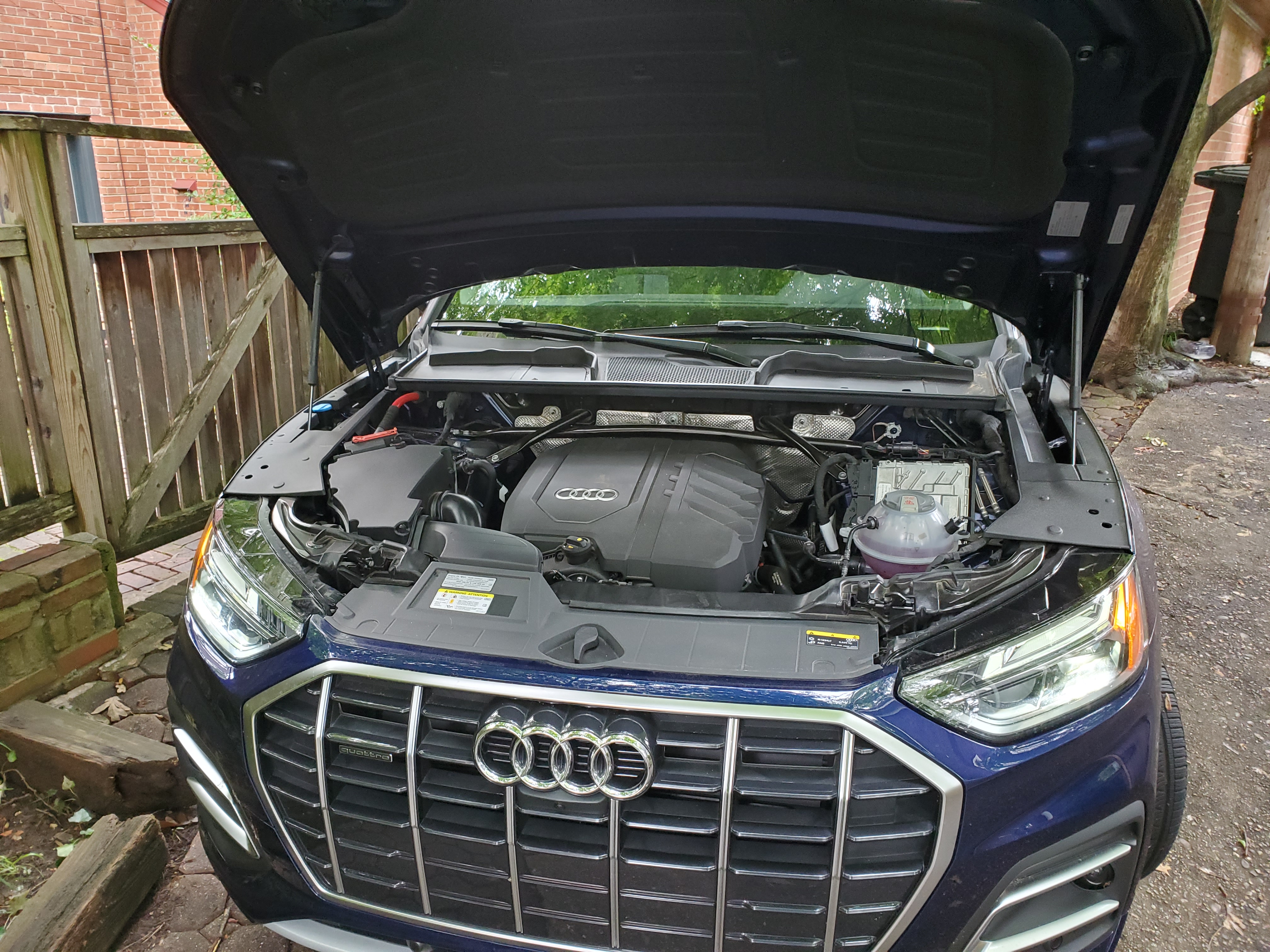 Audi q5 hood open reveling the The 2- liter TSFI engine
